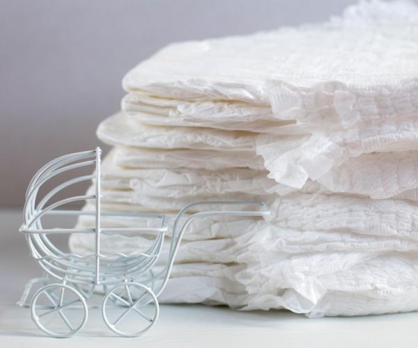 baby-diapers-with-toy-carriage-on-a-white-backgrou-2025-02-12-18-31-44-utc-min baby-diapers-with-toy-carriage-on-a-white-backgrou-2025-02-12-18-31-44-utc-min